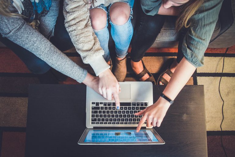 students with a laptop